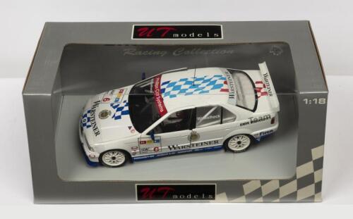 BMW: A NOS 1:18 scale UT Models BMW 320i #6 1997 STW "Warsteiner" Winkelhock die-cast model
