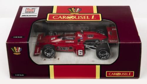 INDY CAR: A NOS 1:18 scale Carousel 1 McLaren M16 Indianapolis 500 "Cam 2 Motor Oil" Mario Andretti #6 1976 Indianapolis 500 die-cast model with Certificate of Authenticity