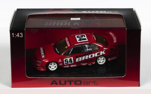 HOLDEN: A NOS 1:43 scale Biante Holden VX Commodore 2002 "Team Brock" C. Baird #54 die-cast model with numbered Certificate of Authenticity