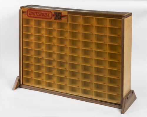 COUNTER DISPLAY: A Matchbox Retail Counter Display Unit to hold 75+1 Matchbox vehicles with slide up clear (discoloured) front acrylic panel. Dimensions W75cm x H54cm x D23cm. Note: This item is used