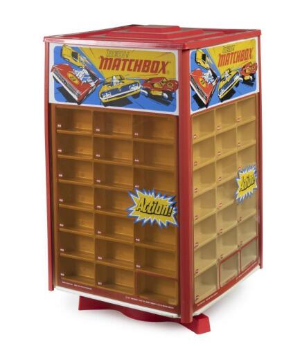 COUNTER DISPLAY: A Matchbox Retail Mains Electric Motorized Revolving Lighted Counter Display Unit to hold 75+5 Matchbox vehicles with 4 acrylic sides (discoloured) and removable top cover to insert light bulb. Dimensions W37cm x H64cm x D37cm. Note: This