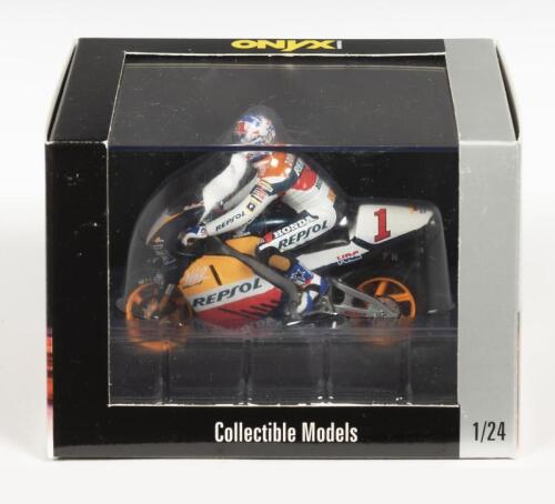 HONDA: A NOS 1:24 scale Onyx Collection Honda NSR V4 "Team HRC Repsol" #1 Michael Doohan die-cast model with rider