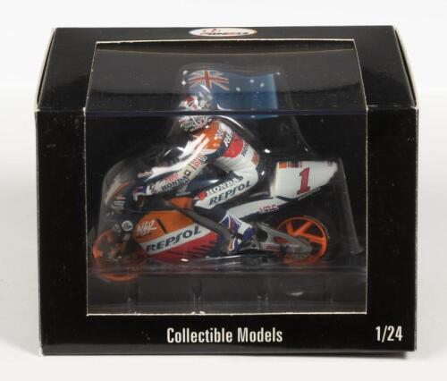HONDA: A NOS 1:24 scale Vitesse 2-Wheels Collection Honda NSR 500 "Repsol" #1 Mick Doohan 1998 World Champion die-cast model with rider & Flag