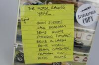 1969: A signed copy of &lsquo;The Motor Racing Year&rsquo; with 9 period drivers signatures including McLaren, Hulme, and Fittipaldi - 2