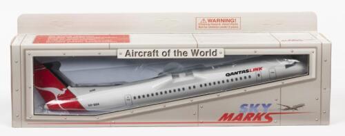 SKY MARKS: A NOS 1:100 scale Sky Marks Snap-Fit Bombardier DH8-400 QantasLink