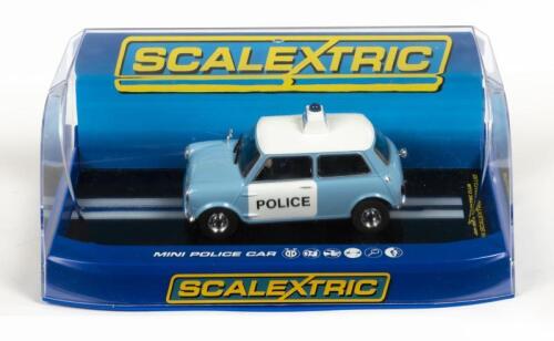 SCALEXTRIC: A NOS 1:32 scale Scalextric Morris Mini Police Slot Car with Front + Rear Lights & Flashing Light