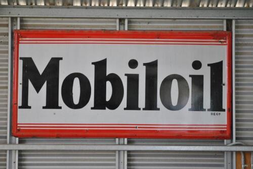 MOBILOIL: A large early 'Mobil Oil Regd' enamelled signed with embossed border, paint touch ups, approx 91cm high, 183cm wide