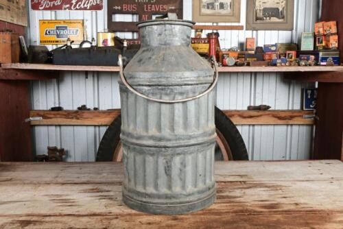 OIL DRUM: A rare early four gallon drum with brass plaque reading "4 GAL", embossed with markers mark "Joyce", and VIC registration seals to neck, 58cm high including handle