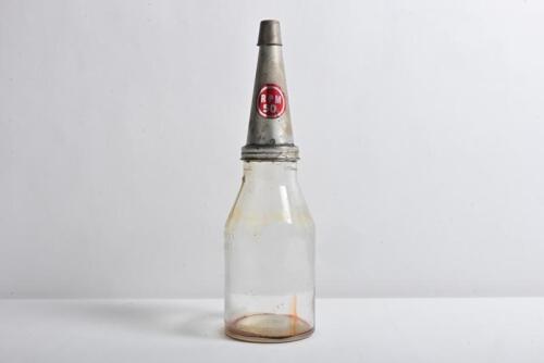 VACUUM: A one imperial quart oil bottle, with "RPM 50" tin pourer and dust cover, embossed to base of bottle "Property of Vacuum Oil Company Pty Ltd"