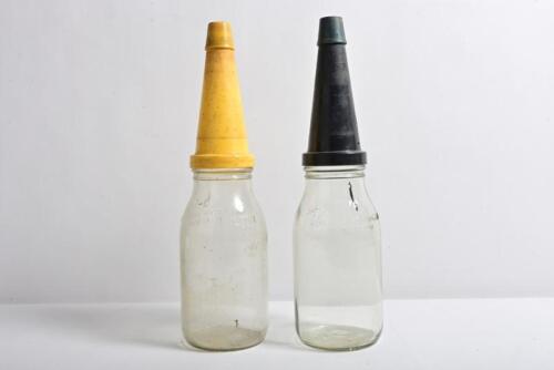 OIL BOTTLES: Two one litre&nbsp;oil bottles with plastic pourers and lids