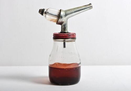 OIL BOTTLE: A one imperial pint oil bottle with application to lid