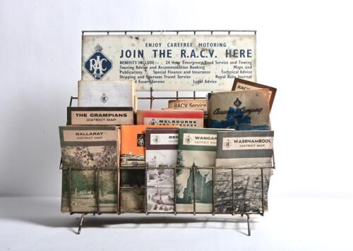 RACV: A collection of circa 1970s maps in a wire rack, including a 1960s "Caravan and Camping Guide", a "Services Available to Members" and a "Golden Fleece NSW&nbsp;Map"