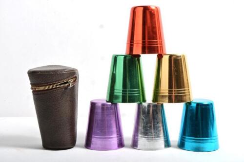 CUPS: Five anodised aluminuim cups in a leatherette&nbsp;case, 14cm high, zip needs repair