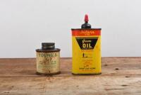 GUN OIL: Two three fluid ounce gun oil tins, including Outers