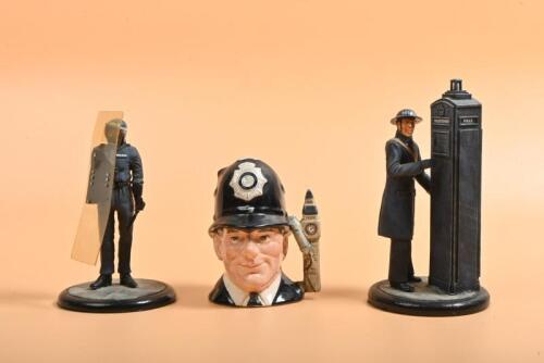 LONDON POLICE: Three English Police figurines. Paul Slade Riot Police figurine & ROYAL DOULTON 'THE LONDON "BOBBY"' Toby Jug