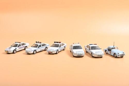 AUSTRALIAN POLICE CARS: A collection of 1:43 scale Australian Police cars by PARADISE GARAGE based on the VR Holden Commodore. N.S.W, VIC, W.A Police cars