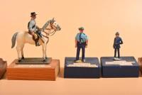 VICTORIA POLICE: A collection of Victoria Police metal figurines. 'MOUNTED TROOPER MELBOURNE POLICE 1851' and POLICE Air Wing figurines - 3