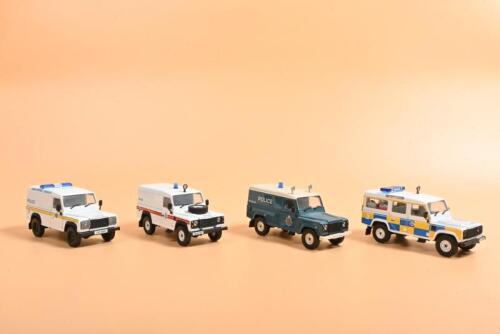 LAND ROVER: Four Land Rover Defender 1:43 scale models by Corgi. 'POLICE' liveries