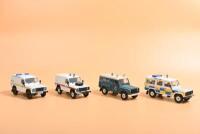 LAND ROVER: Four Land Rover Defender 1:43 scale models by Corgi. 'POLICE' liveries
