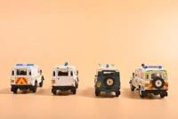 LAND ROVER: Four Land Rover Defender 1:43 scale models by Corgi. 'POLICE' liveries - 4