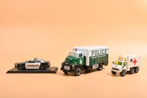 EMERGENCY VEHICLES: Three emergency vehicle models. First Gear GMC Truck in 'POLICE EMERGENCY SERVICE DISTRICT'