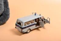 RUSSIAN: Two items related to Russia. 1:43 scale RAF Russian Police Bus (2203) & Shapka - 5