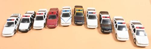 CHEVROLET CAPRICE: A collection of ten 1:43 scale ROAD CHAMPS Chevrolet Caprice Police cars. Each in different American State Police/Patrol/Trooper livery. Circa 1990's