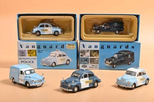 MORRIS: A collection of boxed and unboxed Lledo Vanguards Morris Minor Police car and van models. Limited Edition MORRIS MINOR PANDA CAR numbered '0960'/2800 & 'METROPOLITAN POLICE DOG SECTION MORRIS MINOR VAN' in dark blue numbered '0478'/4000