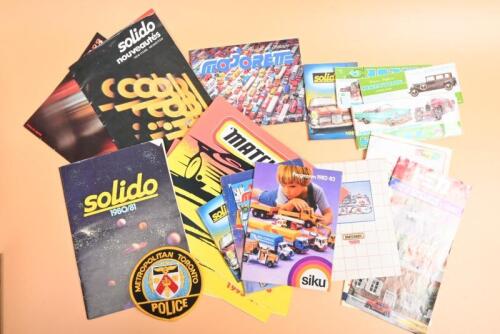 MODEL CATALOGUES: A collection of model car catalogues and other items. BRUMM, ELIGOR, majorette, solido, 1982 TOMICA & DANDY, Diapet, Matchbox catalogues. 'METROPOLITAN TORONTO POLICE' cloth badge
