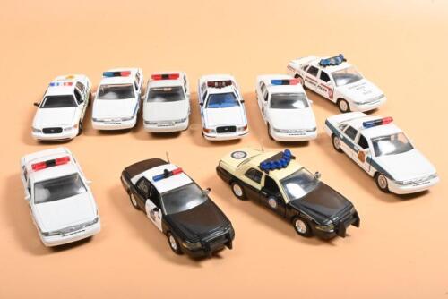 CROWN VICTORIA: A collection of ten Ford Crown Victoria Police cars in various American state POLICE/PATROL/TROOPER liveries. Circ 1990's
