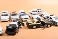 CROWN VICTORIA: A collection of ten Ford Crown Victoria Police cars in various American state POLICE/PATROL/TROOPER liveries. Circ 1990's - 2