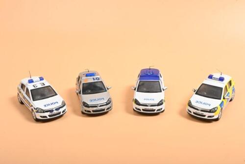 ASTRA: Four 1:43 scale Lledo Vanguards 2004 Astra Police cars