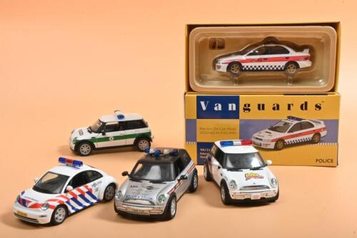 MODERN POLICE CARS: A group of 1:43 scale modern Police cars. Limited Edition Lledo Vanguards Subaru Impreza Turbo in Humberside livery (VA12101) numbered '0238' of 1100. Corgi MINI Police cars
