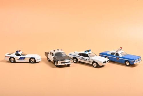 AMERICAN POLICE CARS: Four 1:43 scale American Police models. ROAD CHAMPS 1969 GTO & ROAD CHAMPS Dodge Viper in 'CITY OF ORLANDO' livery