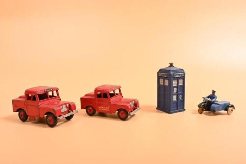 DINKY: Four Dinky items. Land Rover models, Telephone Booth and Sidecar