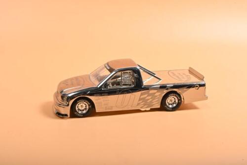 FORD: A 1:24 scale Limited Edition RACING CHAMPIONS NASCAR Super Truck Ford F-150 in chrome. Numbered '0754' of 5000