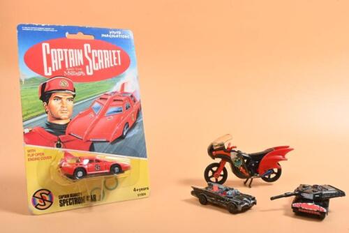 BATMAN/CAPTAIN SCARLETT: A group containing diecast vehicles related to super heroes. 'CAPTAIN SCARLETT AND THE MYSTERONS' SPECTRUM CAR i n blister pack. BATMAN models