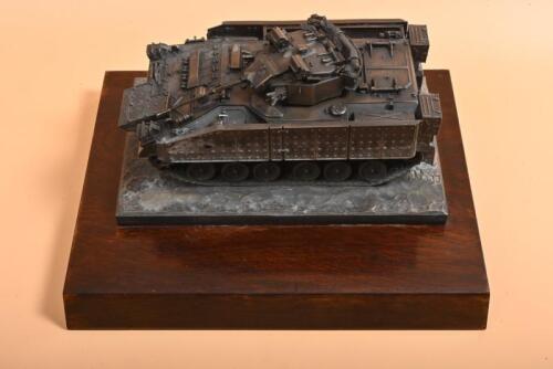 <p>WARRIOR: A die-cast metal 1:24 scale of a British Army "Warrior" tracked armoured vehicle mounted on a mahogany stand</p>
