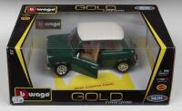 MINI COOPER: A Bburago 1:18 scale MINI COOPER (1969). Green body, white roof