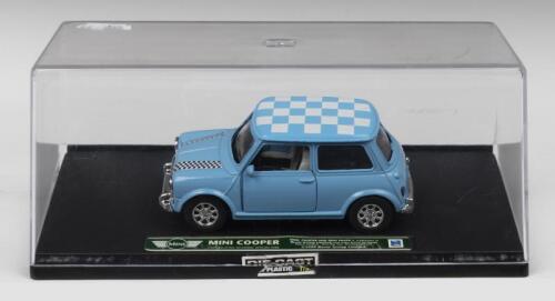 MINI COOPER: A New Ray 1:43 scale Mini Cooper in light blue