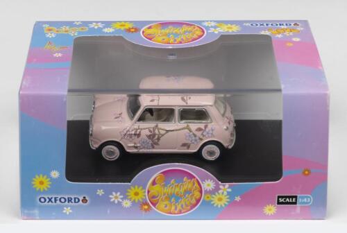 MINI: A OXFORD 1:43 scale Morris Mini pink floral car in 'M & S Twiggy advert' livery (MIN014)