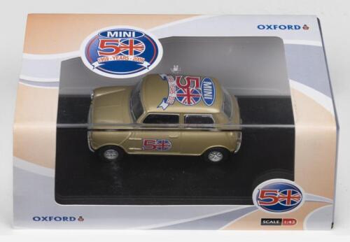 MINI: A OXFORD 1:43 scale Morris Mini in gold. Model celebrates the 50th Anniversary of Mini (SP010)