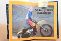 MOTORCYCLES: A 1981 edition of 'The Motorcyclist's Handbook' hardcover book by David Minton, published by Pan Books Ltd, 239 pages; with numerous motor cycling racers signatures including Giacomo Agostini, Stuart Graham, Phil Read, John Surtees. - 4