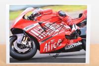 CASEY STONER: A colour picture of Casey Stoner on Ducati. Personally inscribed and signed by Casey Stoner