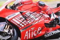 CASEY STONER: A colour picture of Casey Stoner on Ducati. Personally inscribed and signed by Casey Stoner - 2