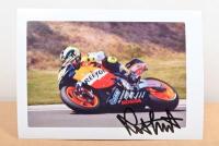 VALENTINO ROSSI: A colour picture of Valentino Rossi on Repsol Honda #46. Autographed by Valentino Rossi