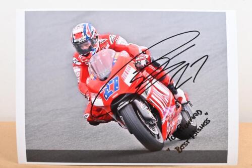 CASEY STONER: A colour picture of Casey Stoner on #27 Ducati. Personally inscribed and signed by Casey Stoner
