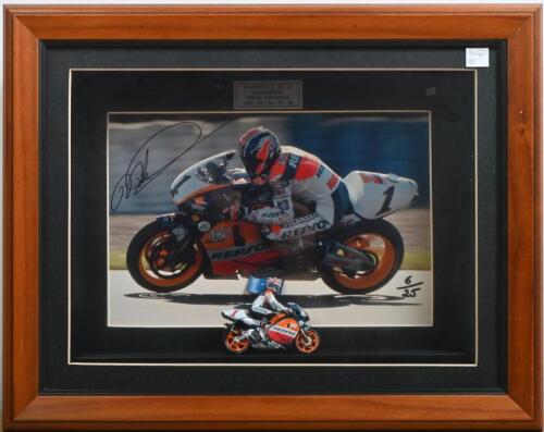 MICK DOOHAN: A numbered autographed photo of Mick Doohan in shadow box frame with scale model of Doohan's No.1 Honda Repsol motorcycle