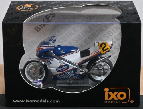 HONDA: A NOS 1:24 scale IXO Models Honda NSR 500 #2 Wayne Gardner 1987 Champion die-cast model