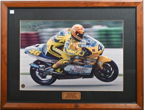 ROSSI: A large framed and glazed photo of Valentino Rossi '500cc Honda World Champion' 125cc 1997 - 250cc 1999, autographed by Rossi